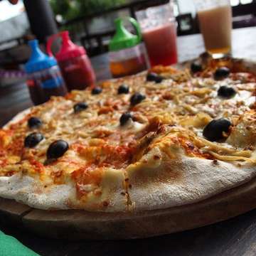 Visit Warung Bola by the Seminyak beach for fire brick oven baked pizza goodness!